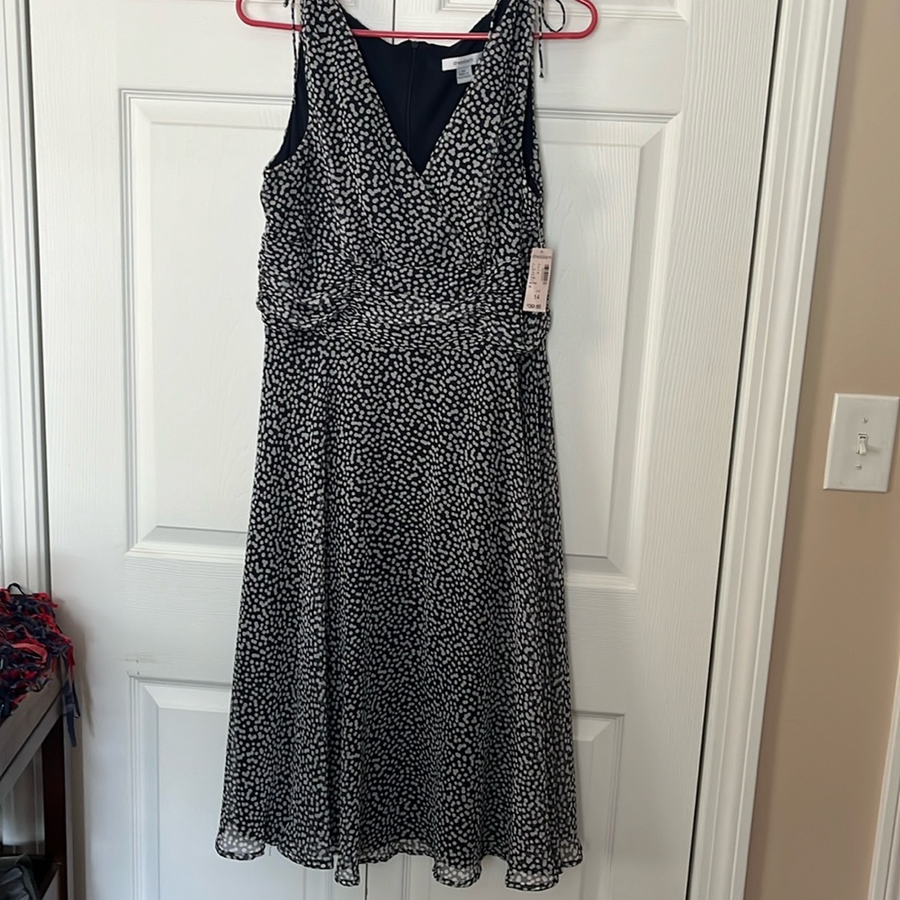 Navy dotted empire waist v-neck dress.